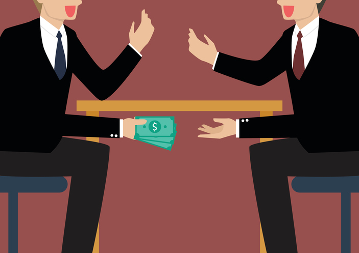 Businessmen Passing Money Under the Table