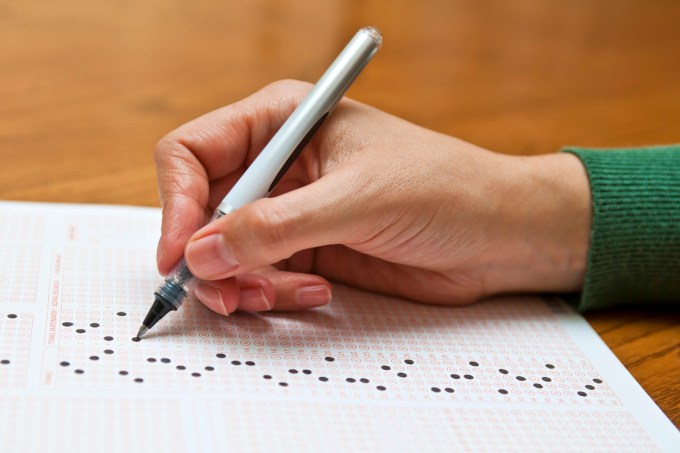 Filling answer sheet of an examination.
