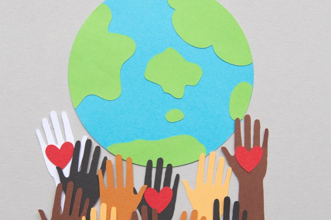 protesting hands around a globe