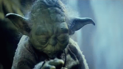 Gif animado do personagem Mestre Yoda, de Star Wars, levantando a cabeça enquanto estende sua mão esquerda.