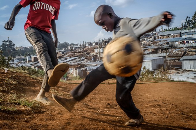 Kids playing football in Kibera slums.Inside Africas