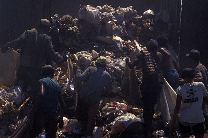 Pickers sort through garbage finding recyclables as a means
