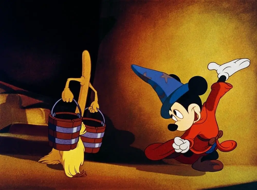 Mickey Mouse no filme "O Aprendiz de Feiticeiro" conversa com uma vassoura