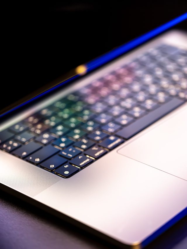 cropped-laptop-computer-with-halfopen-screen-dark-background.jpg